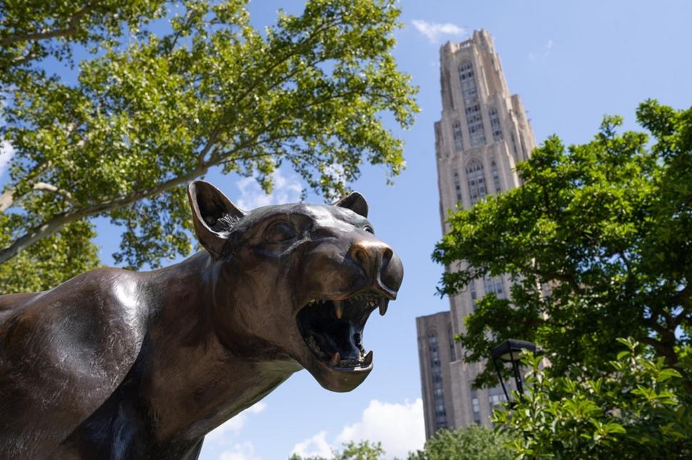 Panther statue with the Cathedral of Learning in the background